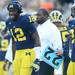 Michigan quarterback Devin Gardner watches from the sidelines as the defense is on the field during overtime against Northwestern at Michigan Stadium on Saturday. Melanie Maxwell I AnnArbor.com